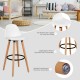 Mid-century barstool with white PU leather seat, beech wood legs, and metal footrest for dining or home bar use.