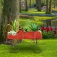 Wooden wagon plant bed in red, showcasing a side view with vibrant plants, perfect for enhancing any garden or patio.