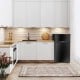 Compact black refrigerator with integrated door handle, adjustable shelves, and door bins, perfect for small spaces.