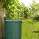 Portable collapsible rain barrel in green, 53-gallon capacity, made of durable PVC, ideal for garden water collection.