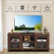 Walnut TV stand with tempered glass doors, 2-tier shelves, and spacious design for up to 65" TVs, ideal for living.