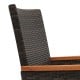 Close-up of the acacia wood armrest and premium hand-woven PE rattan of a patio chair for outdoor comfort.