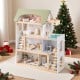 Wooden dollhouse with green roof, 33 furniture pieces, and movable stairs for interactive pretend play.