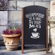Wood A-frame sidewalk chalkboard sign displaying "Coffee is a hug in your mug," ideal for cafes and restaurants.