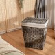 Handwoven gray laundry hamper with removable liner, flip lid, and foldable design for easy storage in any room.