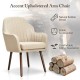 Beige fabric upholstered accent chair with natural rubber wood legs, ergonomic armrests for comfortable sitting.
