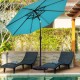 Heavy-duty 30lbs umbrella base with bronze finish, supporting a patio umbrella near two lounge chairs by the pool.