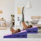 Folding wedge exercise gymnastics mat in purple, featuring handles and durable PVC cover, ideal for home workouts.