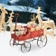 Red wooden wagon plant bed with wheels, featuring two planting sections, perfect for garden or patio decoration.
