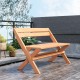 Teak wood folding outdoor bench with slatted seat, X-shaped structure, perfect for backyard or poolside relaxation.