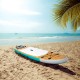 Inflatable 10' stand-up paddle board on the beach, featuring durable construction and portable carry bag for easy.