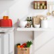 Wall-mounted drop-leaf table in sleek white finish, perfect for small spaces, serving as a dining or storage solution.