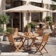 Beige 9 FT patio umbrella with 8 bamboo ribs, providing sun protection for outdoor dining tables and poolside.