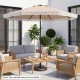 Beige 9 FT patio umbrella with ruffled edges and adjustable tilt, perfect for providing shade in garden or pool areas.