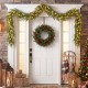 9 FT pre-lit artificial cypress Christmas garland with 50 warm white LED lights, perfect for front door decoration.