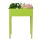 Elevated green garden planter made of galvanized steel, 31.5" high, ideal for easy gardening and stylish outdoor decor.