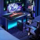 Electric standing gaming desk with height adjustable splice board, carbon fiber texture, ideal for gaming and working.