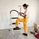 Three-step folding ladder with a sturdy iron construction, perfect for home tasks like changing bulbs and washing.
