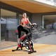 Adjustable indoor exercise cycling bike trainer with electronic meter, featuring a durable frame and comfortable saddle.