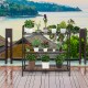 3-tier metal plant stand shelf with sturdy steel frame, ideal for displaying plants and decorations on a balcony.