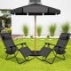 Two black folding lounge chairs with zero gravity design under a patio umbrella, perfect for outdoor relaxation.