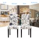 Set of 2 tufted upholstered dining chairs in black and white, featuring solid rubberwood legs for stability and comfort.