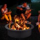 Round 36-inch steel fire pit ring with a powder-coat finish, perfect for DIY outdoor use and creating a warm atmosphere.