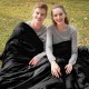 Couple enjoying the 2 Person Waterproof Sleeping Bag in black, perfect for camping and outdoor adventures.