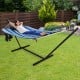 Hammock chair stand set with soft cotton fabric and pillow, perfect for relaxing in your outdoor garden.