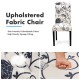 Tufted upholstered dining chair in black and white with breathable fabric and solid rubberwood legs for stability.