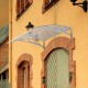 Gray 40" x 40" outdoor polycarbonate door canopy awning, providing sun and rain protection for entrances and windows.