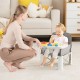 Portable gray baby booster seat with removable double tray, designed for indoor and outdoor use, ideal for dining.