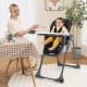 Convertible black baby high chair with adjustable seat height and removable tray, perfect for feeding and playtime.