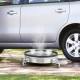 Stainless steel 4000PSI pressure washer surface cleaner with casters, ideal for cleaning decks and driveways.