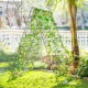 A-frame garden trellis in green for climbing plants, made of rust-resistant steel, ideal for flowers and vegetables.