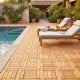 Acacia wood interlocking deck tiles shown on a patio by the pool, ideal for outdoor spaces and easy to assemble.