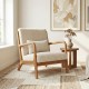 Beige corduroy accent chair with lumbar pillow, solid wood frame, ideal for living rooms and reading areas.