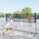 Adjustable 10-foot badminton net stand with a sturdy metal frame, ideal for yard or beach sports activities.