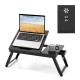 Adjustable bamboo laptop desk with tilting top, drawer, and fan-shaped design for optimal viewing and heat dissipation.