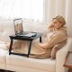 Adjustable bamboo laptop desk with tilting top, featuring a drawer, ideal for cozy work or study in any room.