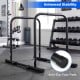Adjustable dip bar station in black with anti-slip foot pads, designed for stability and various workout exercises.