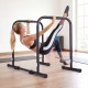Adjustable dip bar station in black with a user performing leg raises, ideal for strength training and calisthenics.