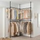 Adjustable black floor-to-ceiling clothes rack with 4 hanging rods, ideal for maximizing storage in closets or rented spaces.
