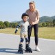 Adjustable kids' incline skates in blue with illuminating wheels, worn by a child for safe outdoor skating.