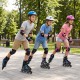 Kids wearing Adjustable Incline Skates with illuminating wheels, skating in a park for fun and safety.