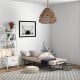Folding guest bed with memory foam mattress, compact design, placed in a stylish room for versatile use.