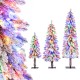 Snow-flocked artificial Christmas tree set of 3 with multi-color LED lights for festive indoor decoration.