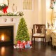 4 ft artificial Christmas tree with pre-lit LED lights, realistic PVC needles, and presents underneath for festive.