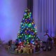 5 ft pre-lit artificial Christmas tree with colorful LED lights and gifts underneath, perfect for festive holiday decor.