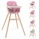 Convertible wooden high chair in pink with removable cushion, adjustable tray, and 5-point harness for baby safety.